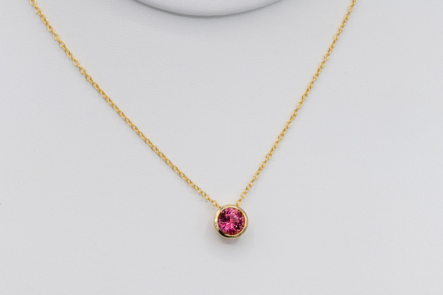Bezel Set Pink Tourmaline Pendant in Yellow Gold