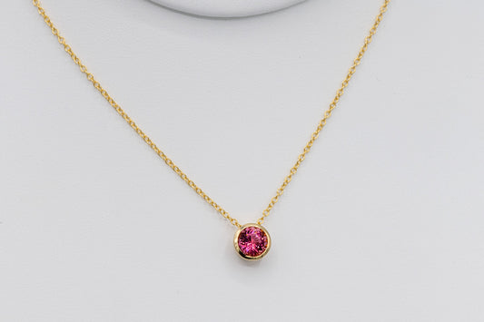 Bezel Set Pink Tourmaline Pendant in Yellow Gold